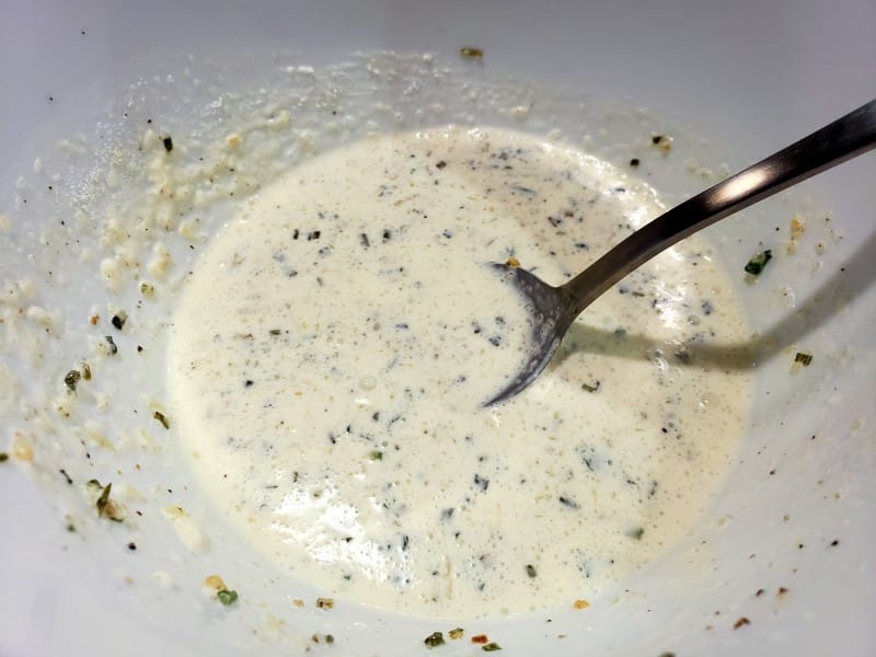 creamy parmesan sauce mixed in a bowl