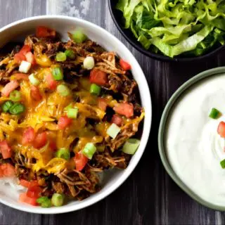 Chicken Taco Bowl, sour cream, and lettuce