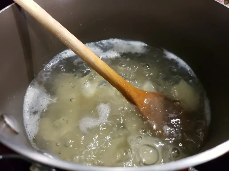 diced potatoes boiling in a pan