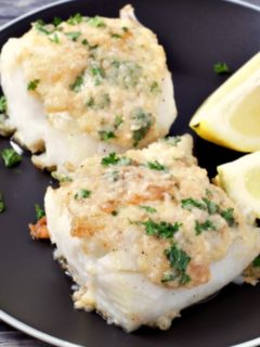 Cod with Garlic Butter on a plate.