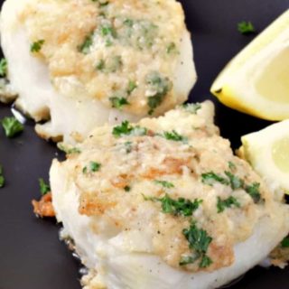 Cod with Garlic Butter on a plate.