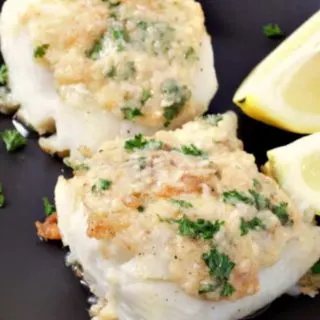 Cod with Garlic Butter on a plate.