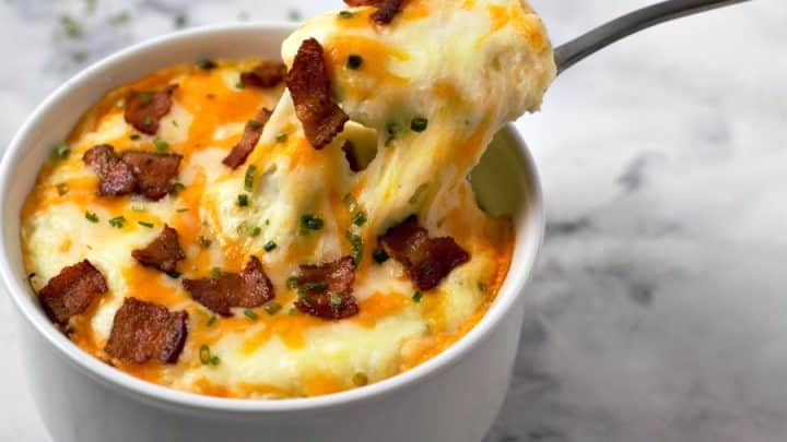 Mashed Potato Casserole with a spoon pulling a bite out