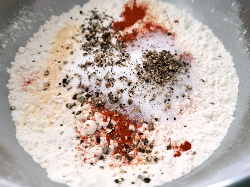 flour, garlic powder, smoked paprika, cayenne, salt, and pepper in a bowl