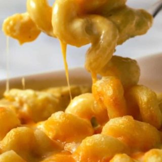 Macaroni and Cheese with a spoon lifting some out.