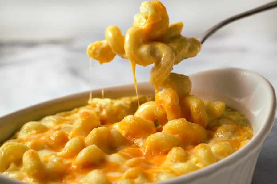 baked mac and cheese for two with cavatappi pasta and Velveeta cheese in a white baking dish