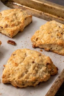 Butter Pecan White Chocolate Scones on a baking sheet.