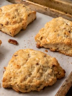 Butter Pecan White Chocolate Scones on a baking sheet.