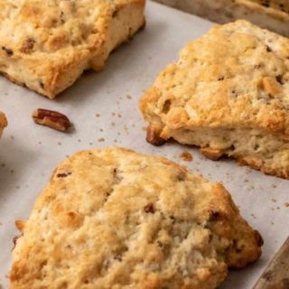 Butter Pecan White Chocolate Scones on a baking sheet.