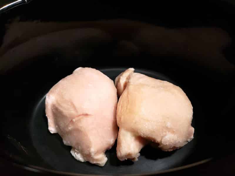 two chicken breasts in a crock pot slow cooker
