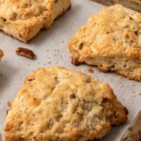 Butter Pecan White Chocolate Scones on a baking sheet.