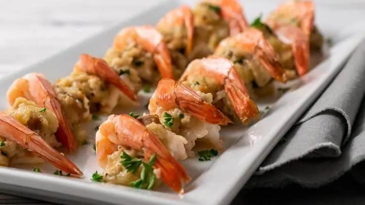 12 stuffed shrimp on a platter