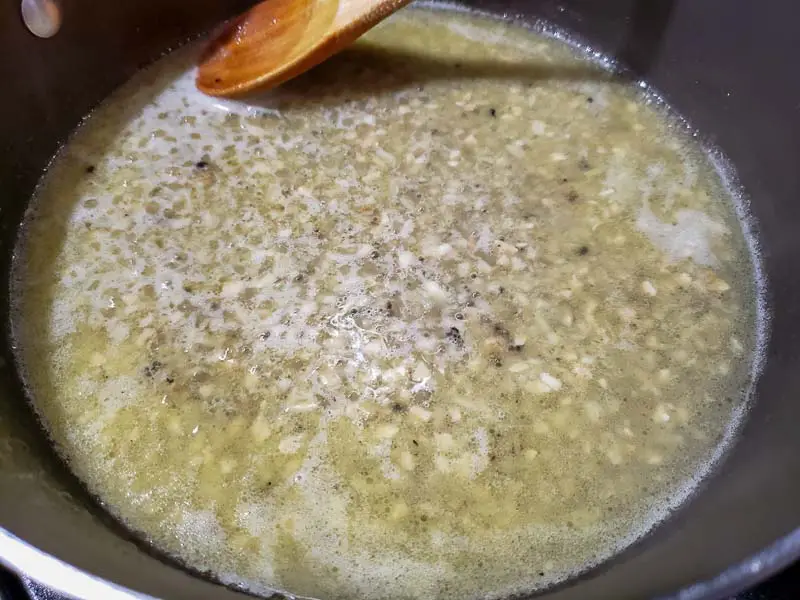 stuffing broth mixture cooking in a pan.