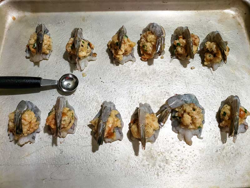 stuffed shrimps on a baking sheet.
