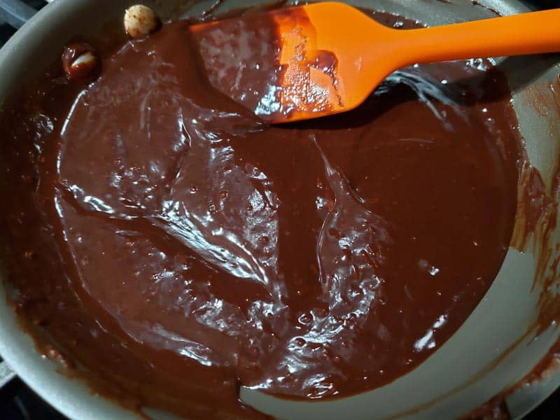 chocolate ganache cooking in a pan.