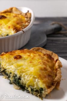 Cheesy Spinach Artichoke Quiche on a plate.