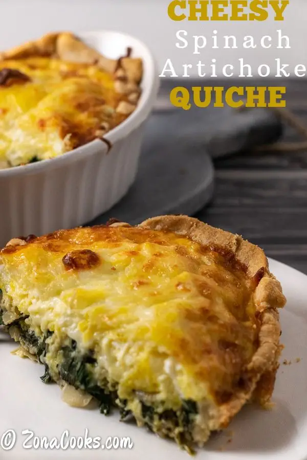 slice of spinach and artichoke quiche on a plate.