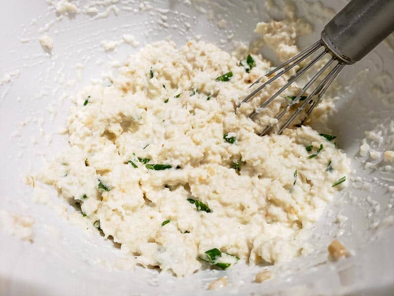 crab and cream cheese mixture whisked in a bowl