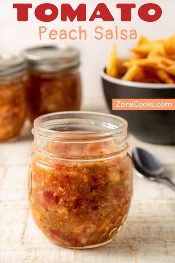 tomato peach salsa in jars with tortilla chips on the side.