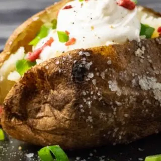 a Crispy Baked Potato on a plate.