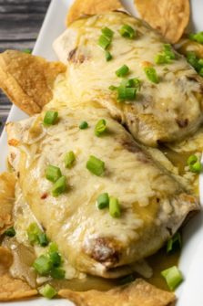 Cheesy Smothered Pulled Pork Burritos on a plate.