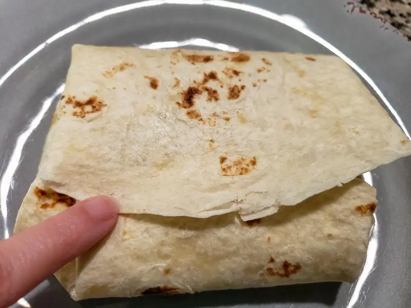 a pulled pork burrito folded like an envelope.