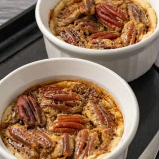 two Pecan Pies in ramekin dishes.