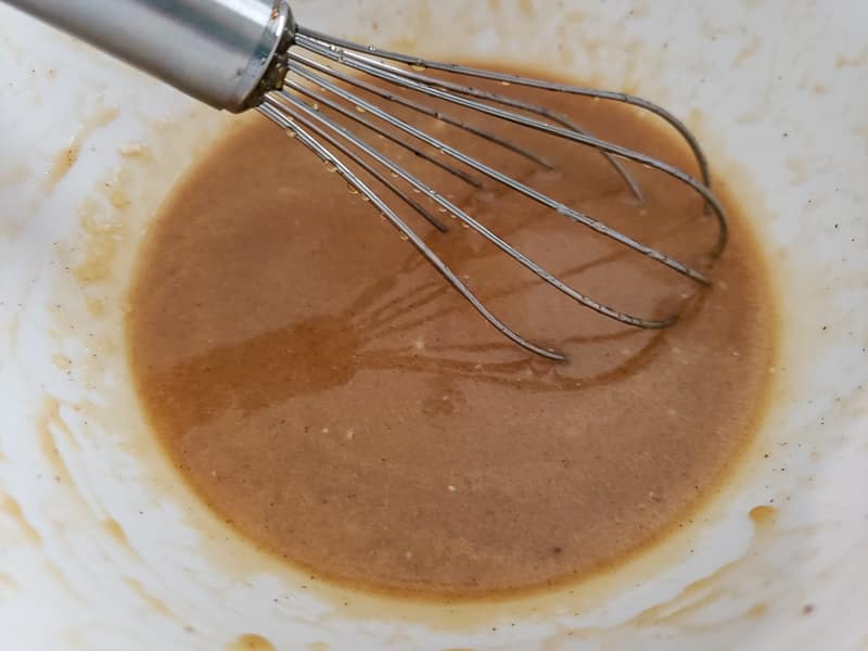 pecan pie filling whisked in a bowl.