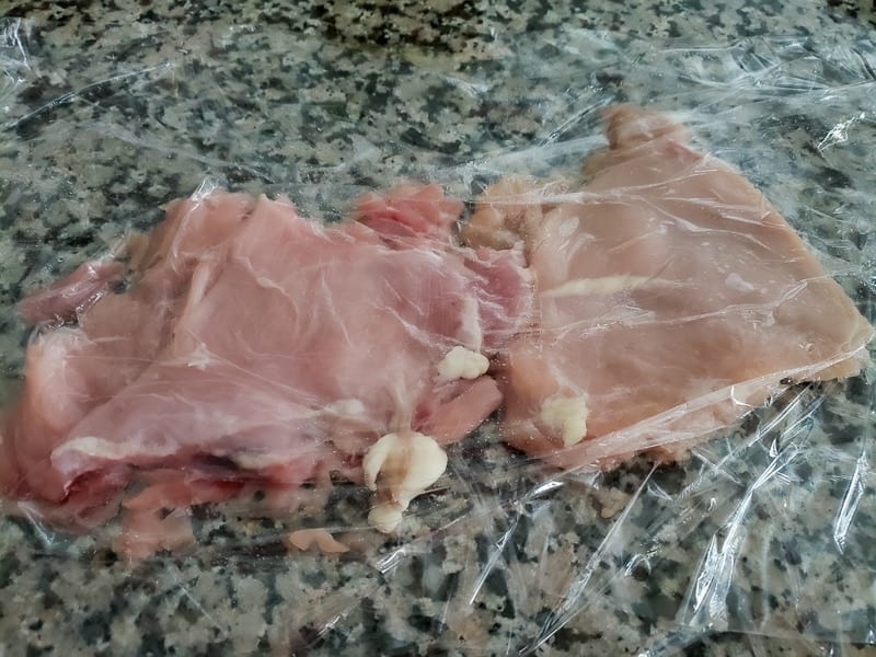 chicken breasts pounded flat in plastic wrap