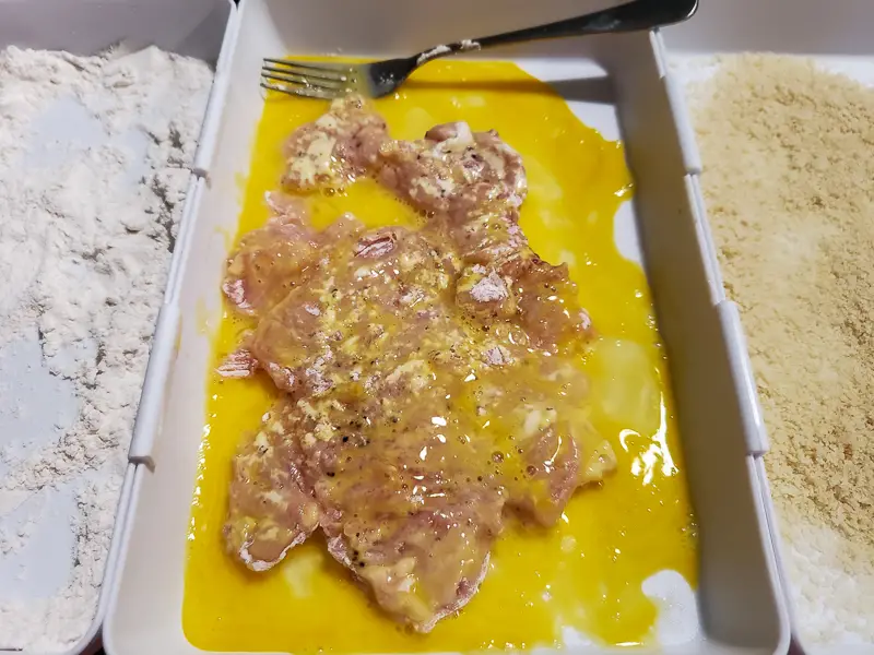 chicken breasts dredged in egg
