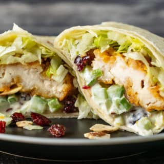 cranberry almond chicken salad wrap on a plate