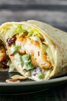 a Cranberry Almond Chicken Salad wrap on a plate.
