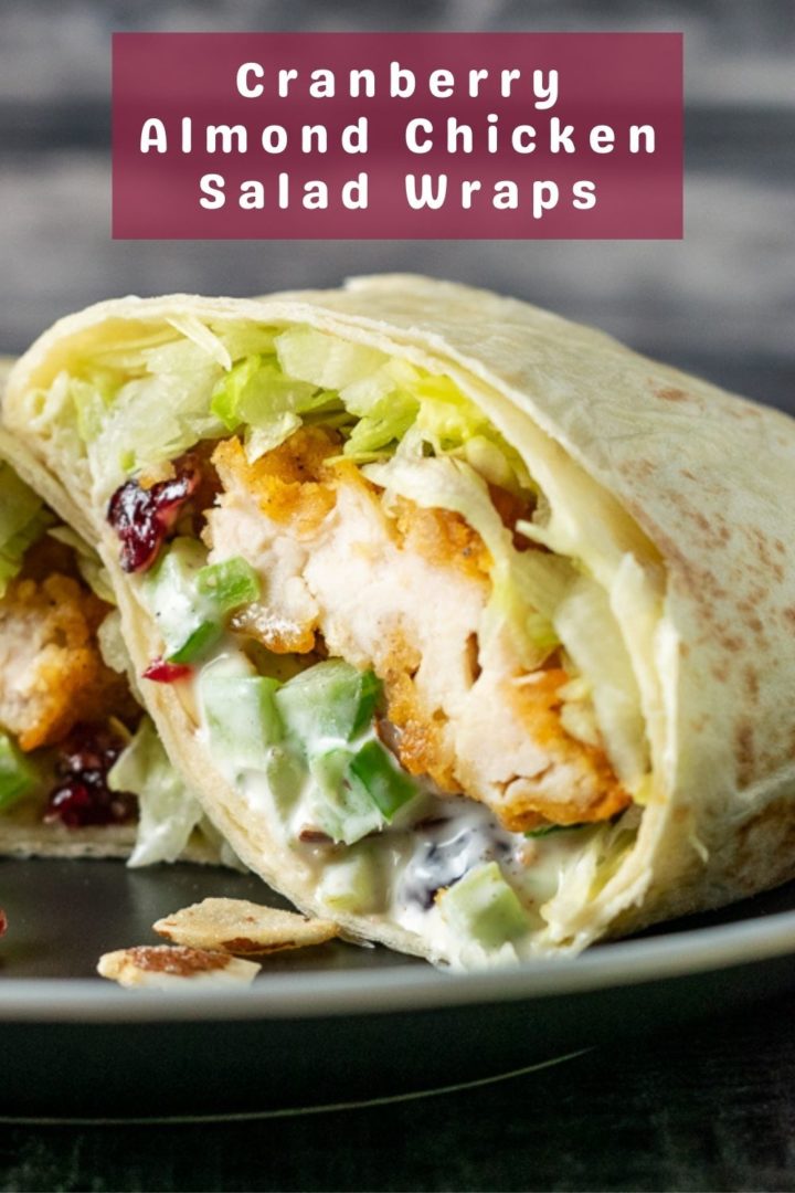 a crispy chicken wrap cut open on a plate.