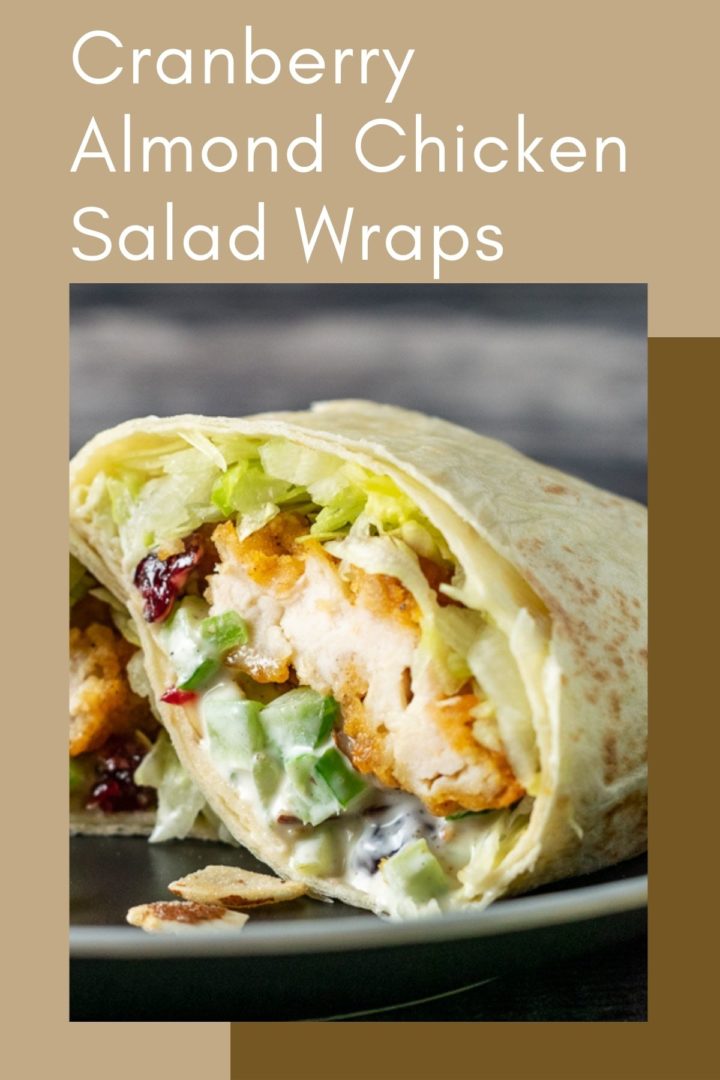 a crispy chicken wrap cut open on a plate.