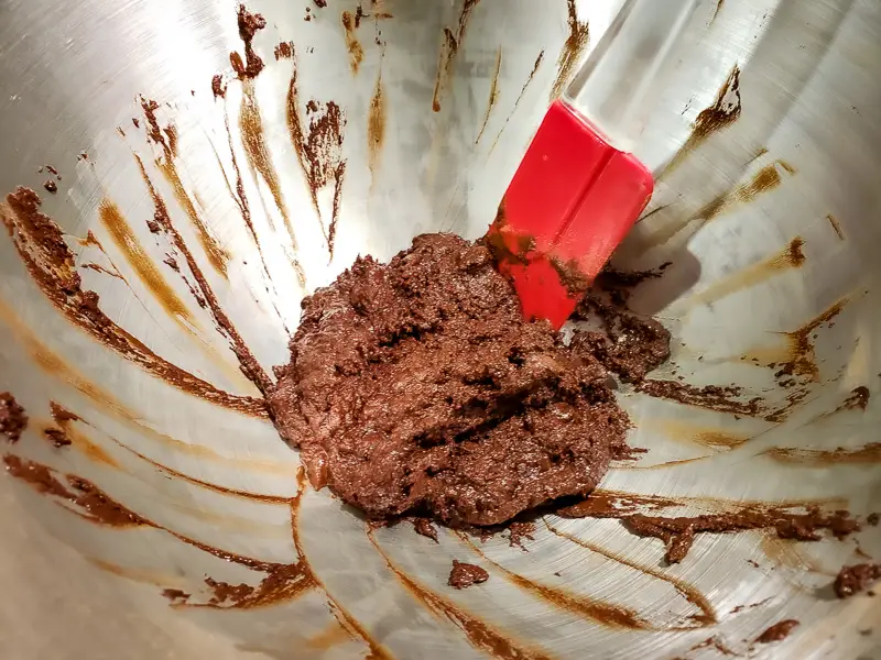 cocoa, baking soda, butter, and hot water mixed in a bowl.