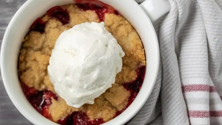 strawberry cobbler with a scoop of ice cream.