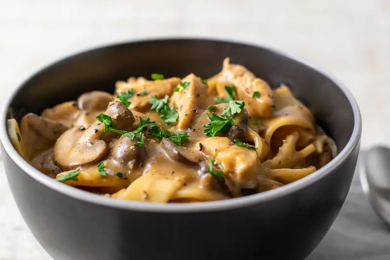 chicken stroganoff with mushrooms and parsley.