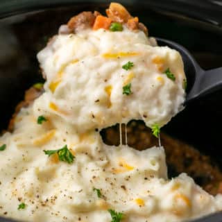 Crockpot Shepherd's Pie with a spoon scooping some out.