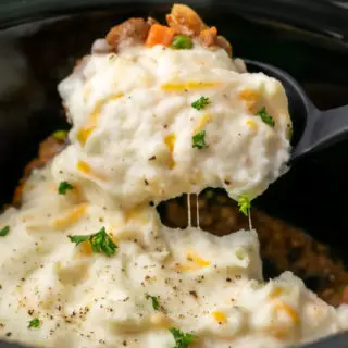 Crockpot Shepherd's Pie with a spoon scooping some out.