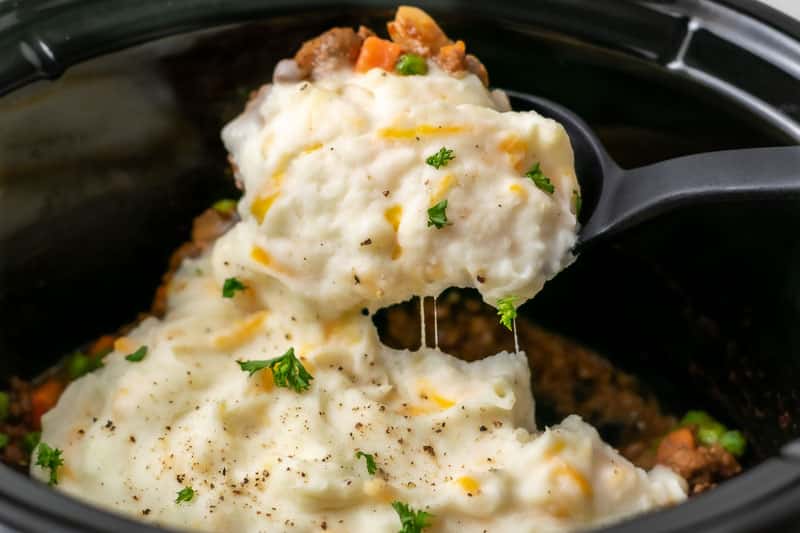 Crockpot Shepherd's Pie with a spoon scooping some out.