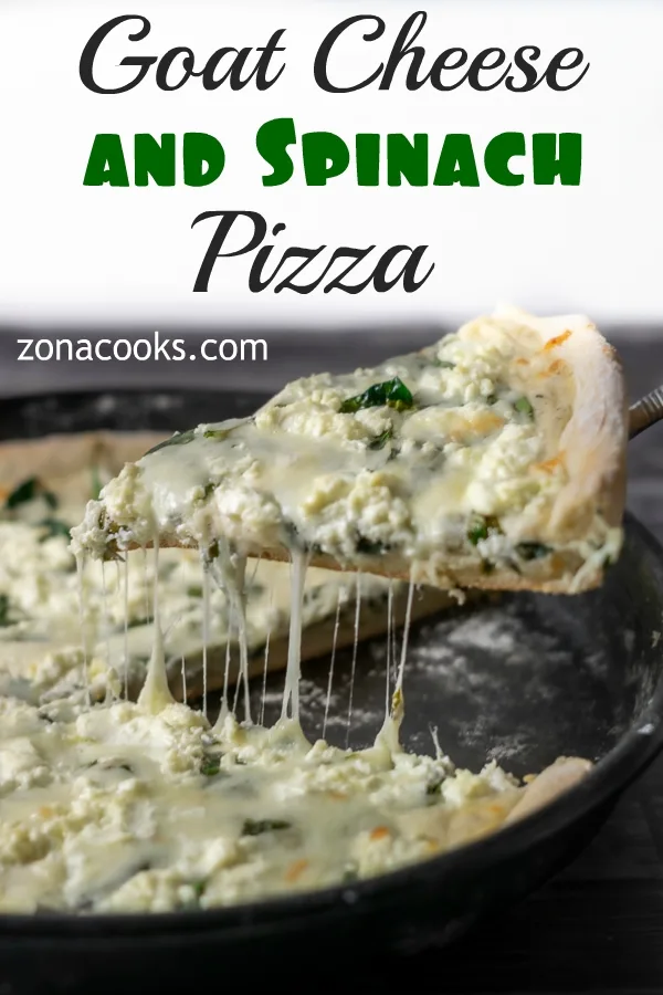 Spinach Goat Cheese Pizza with a slice being lifted out.