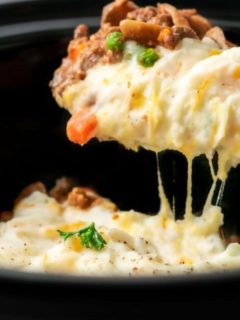 Crockpot Shepherd's Pie with a spoon lifting some out.