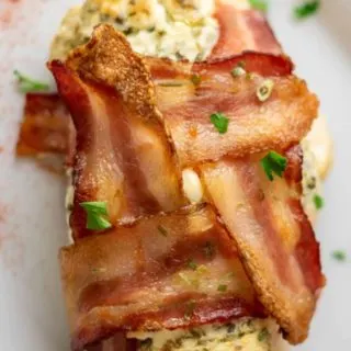 Bacon Wrapped Cream Cheese Chicken on a plate.