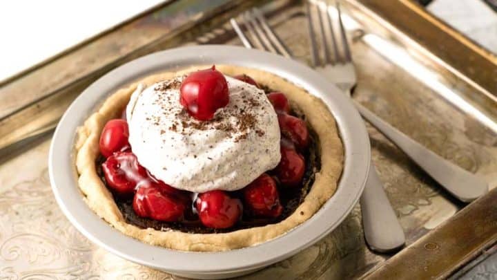 black forest pie on a tarnished tray with two forks
