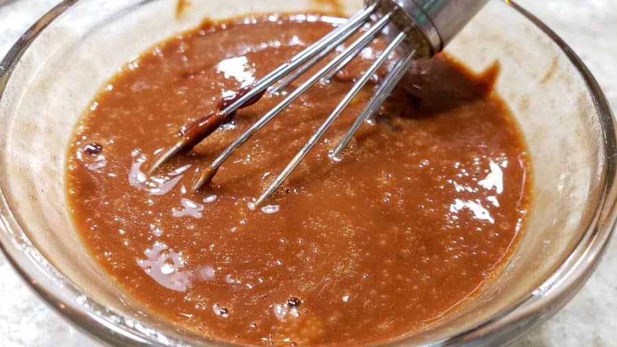 small amount of chocolate sauce whisked into raw egg