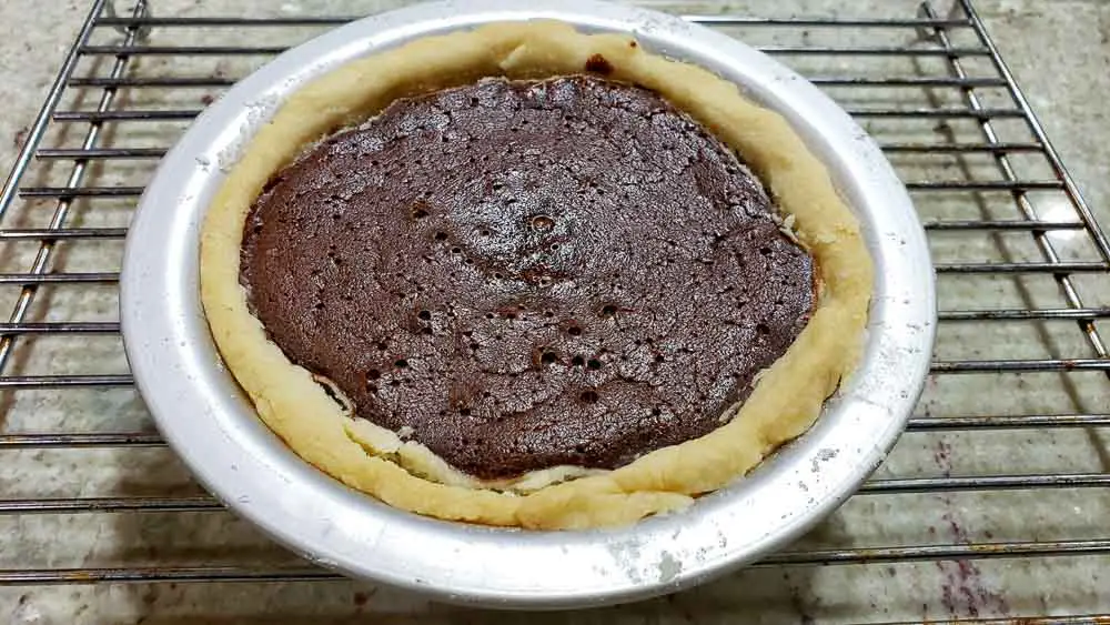 black forest pie cooling on a rack.