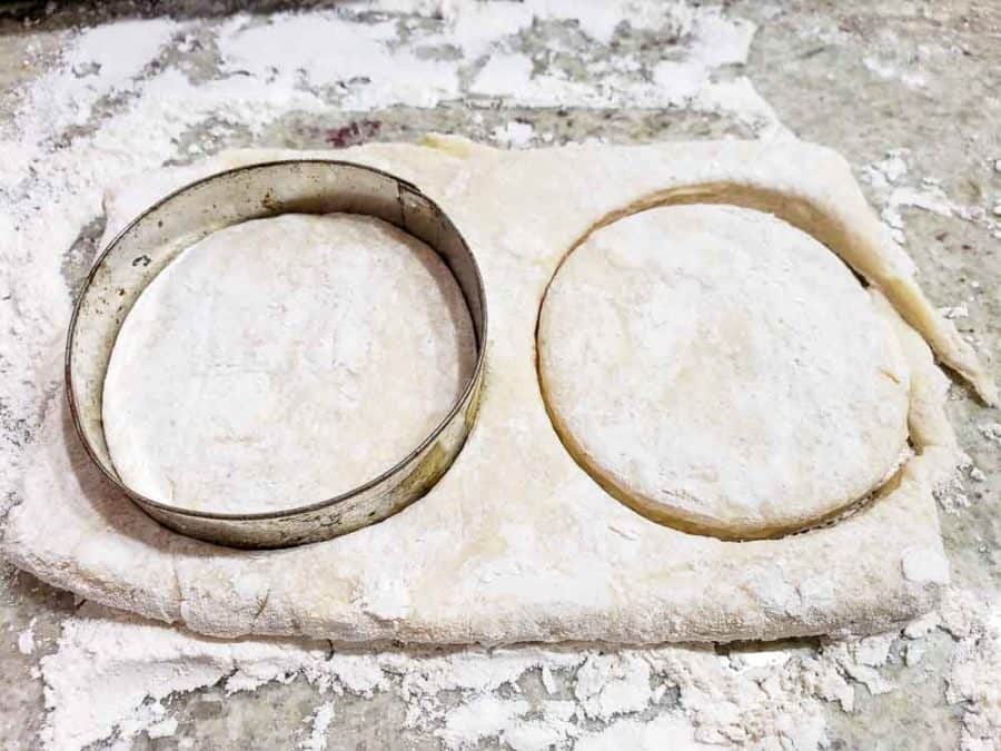 round biscuit cutter cutting out biscuits