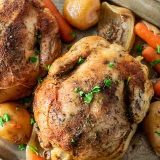 Crockpot Cornish Hens and Veggies on a tray.