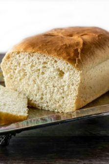 a loaf of White Bread on a tray.
