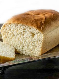 a loaf of White Bread on a tray.
